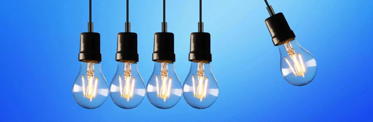 Five lightbulbs in a blue background